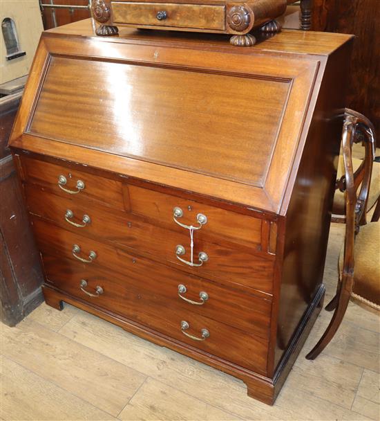 A George II style mahogany bureau by Maple & Co. W.102cm